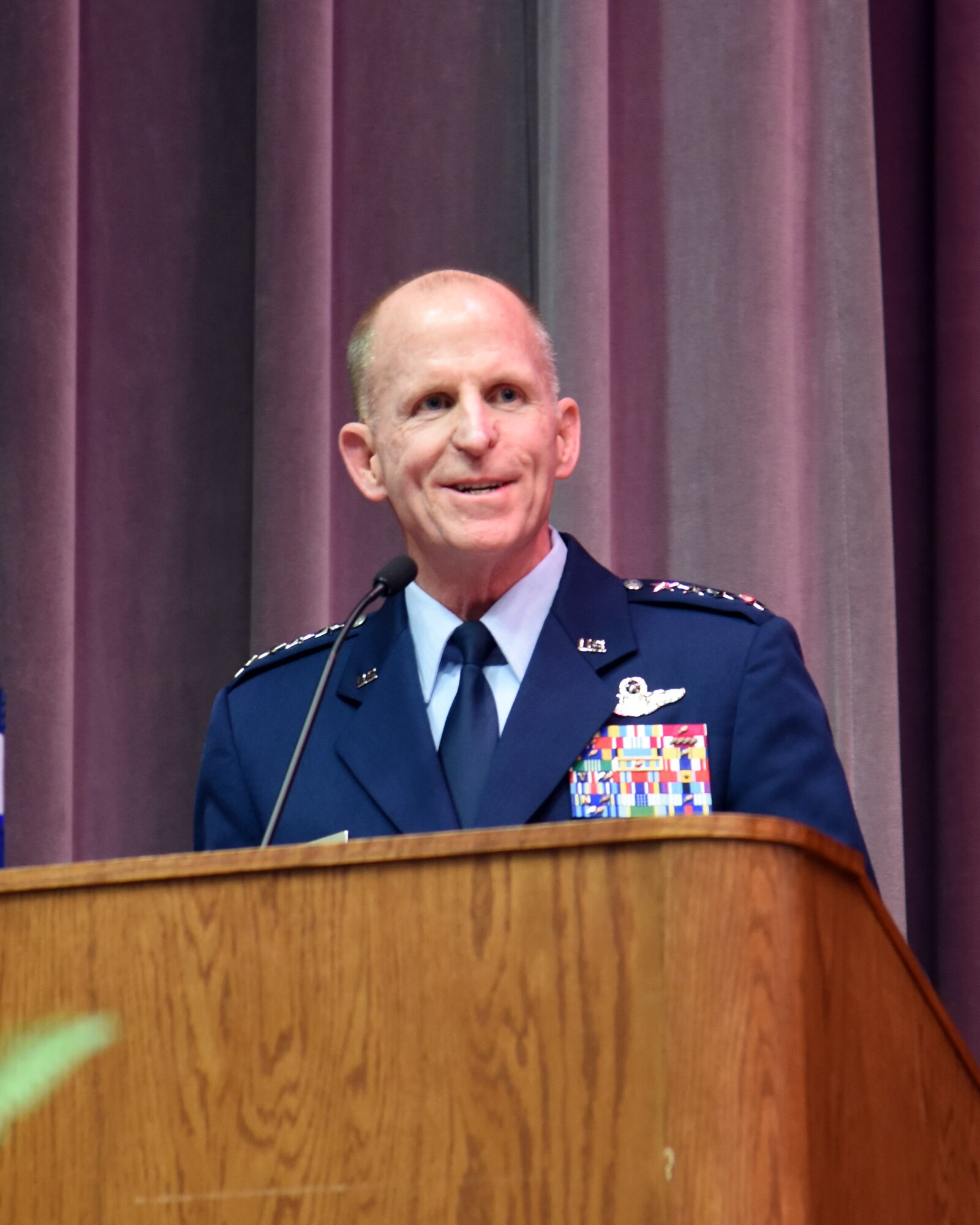 Air Force Vice Chief of Staff Gen. Stephen Wilson speaks to the audience during the retirement ceremony for Richard “Sonic” Johnson, former 14th Flying Training Wing Public Affairs chief, at the Kaye Auditorium Jan. 25, 2019, on Columbus Air Force Base, Mississippi. Wilson was the 14th FTW commander from 2004-2006, while Johnson was the public affairs chief. (U.S. Air Force photo by Melissa Doublin)