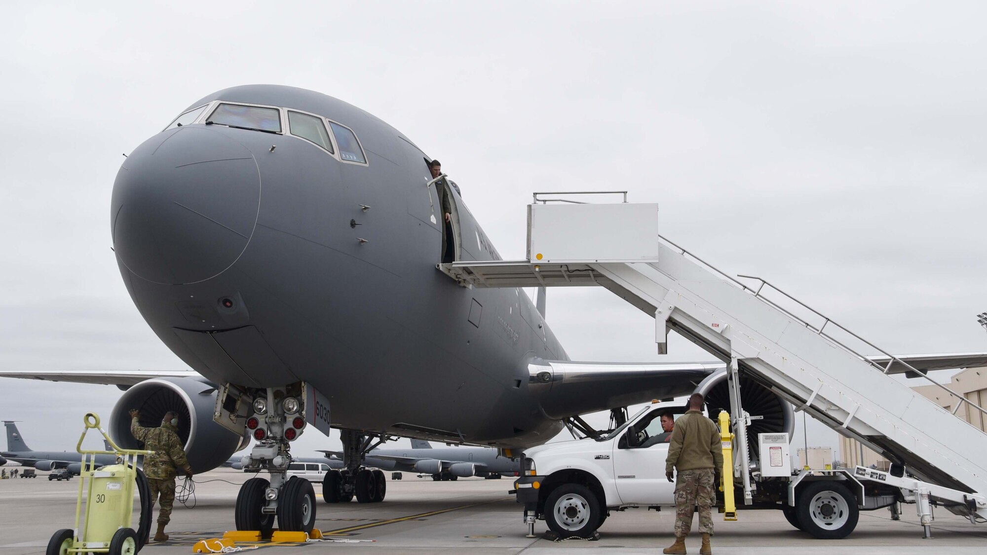 Team McConnell Airmen maneuver a set of air stairs for a newly arrived KC-46A Pegasus , Jan. 31, 2019, McConnell Air Force Base, Kan.  Team McConnell received two more KC-46s, and is scheduled  to receive 18 more over the next year. (U.S. Air Force photo by Tech. Sgt. Abigail Klein)