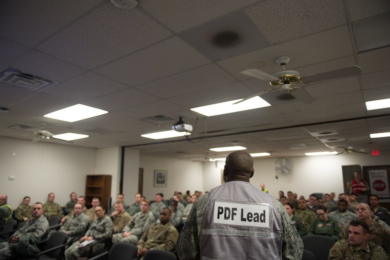 Members of Team Offutt receive briefings in the passenger terminal Jan. 29, 2019, on Offutt Air Force Base, Nebraska. More than 600 members of the base took part in Phase I of Operational Readiness Exercise Winter Havoc. (U.S. Air Force photo by Tech. Sgt. Rachelle Blake)