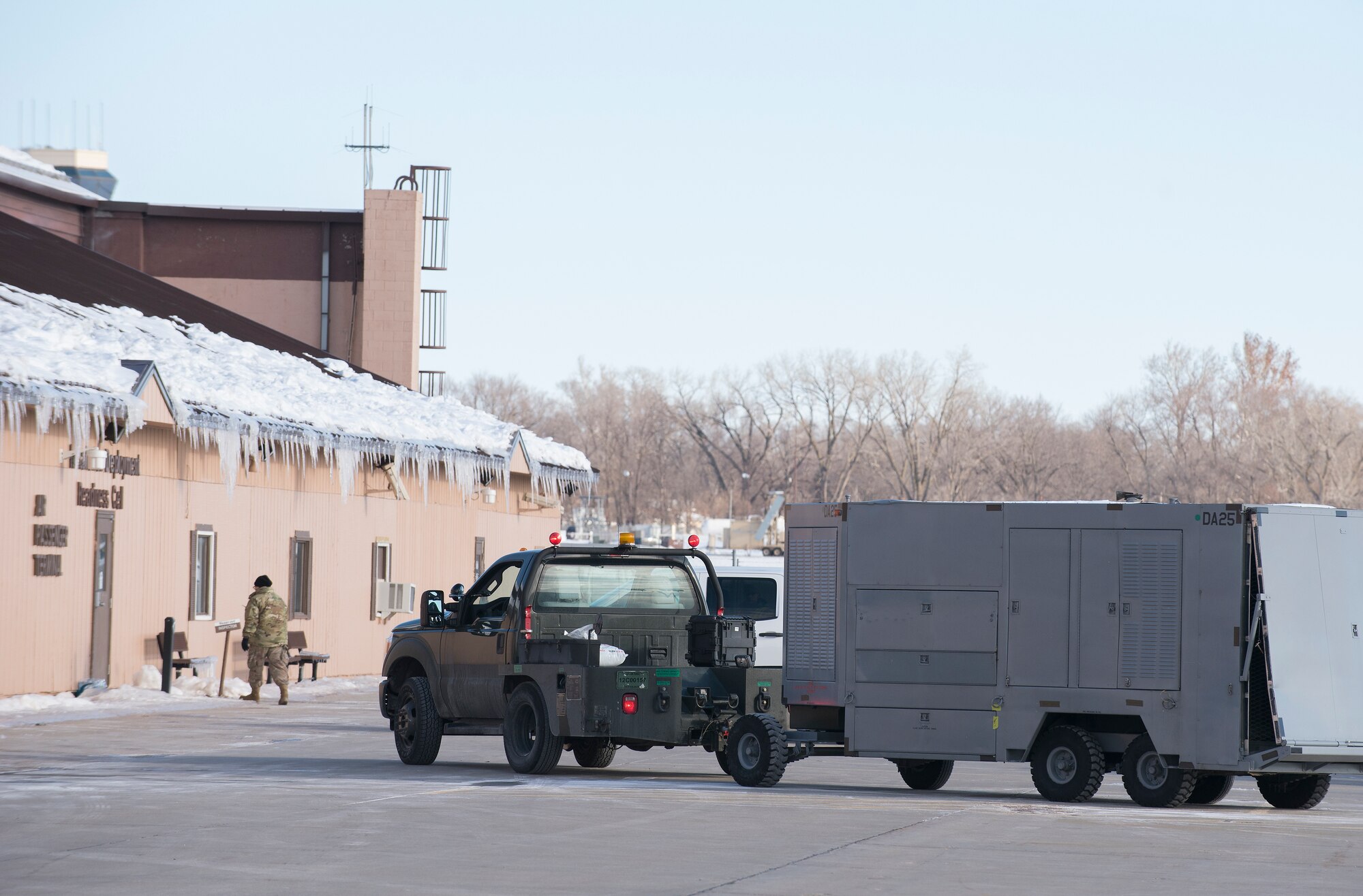 Offutt Airmen move cargo inside the Installation Deployment Readiness Cell yard at Offutt Air Force Base, Nebraska Jan. 29, 2019, while participating in Phase I of Operational Readiness Exercise Winter Havoc. The exercise tested Offutt’s ability to process and deploy a large amount of personnel and equipment on short notice. (U.S. Air Force photo by Delanie Stafford)