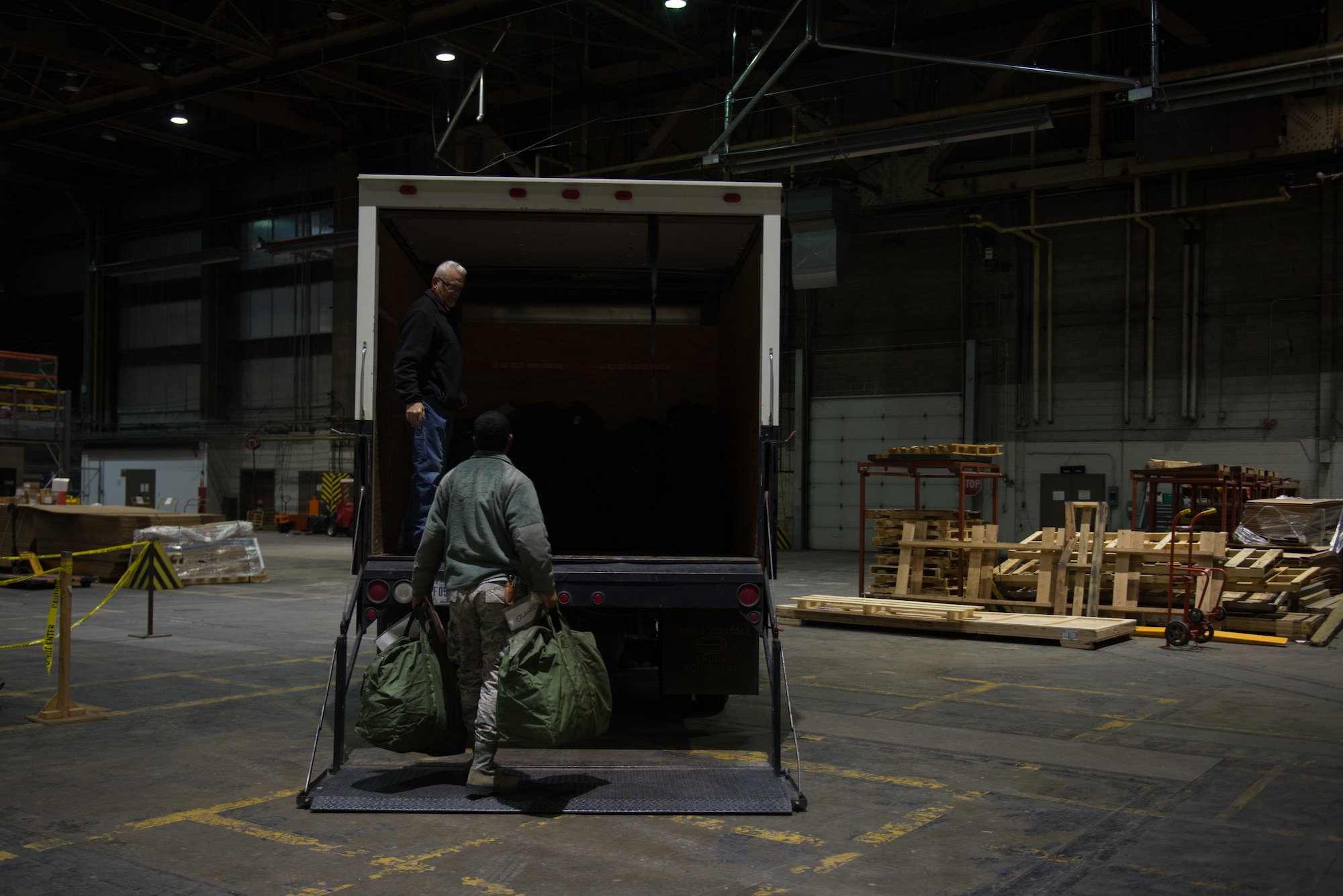 Senior Airman Christopher Orange, 55th Communications Squadron, loads his mobility bags onto a cargo truck Jan. 29, 2019, on Offutt Air Force Base, Nebraska. Orange was taking in part in Phase I of Operational Readiness Exercise Winter Havoc. (U.S. Air Force photo by Tech. Sgt. Rachelle Blake)