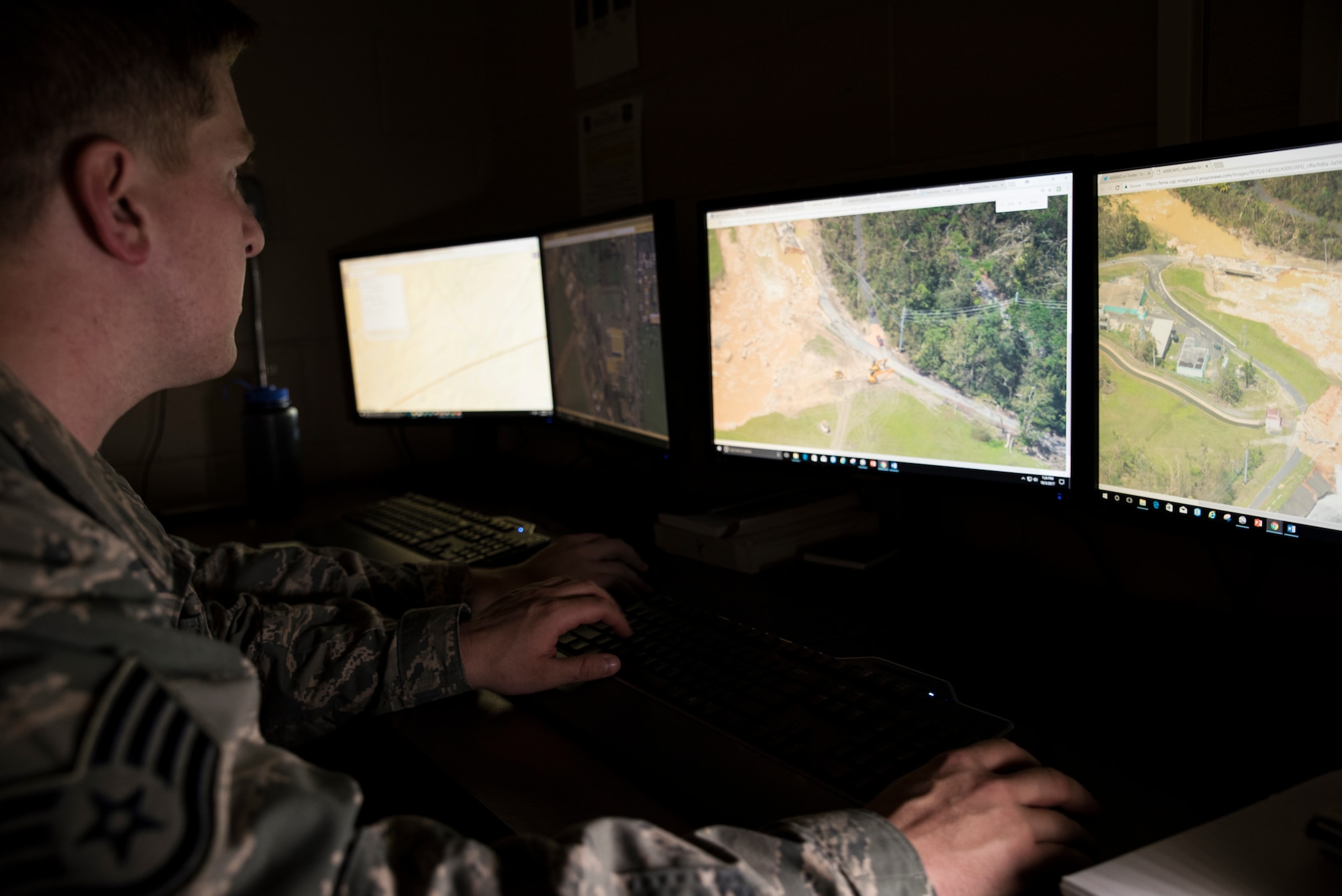 Air National Guard Staff Sgt. Spencer, of the 188th Wing Intelligence Surveillance Reconnaissance Group, assists in Puerto Rico disaster relief by analyzing images of the Guajataca Dam that is located in north west Puerto Rico, Oct. 3, 2017. The dam is eroding and could effect tens of thousands of individuals if it collapses. This Unclassified Processing Analysis and Dissemination station in Fort Smith Arkansas creates situation reports to enhance relief workers ability to assist those effected by hurricanes in Puerto Rico.
