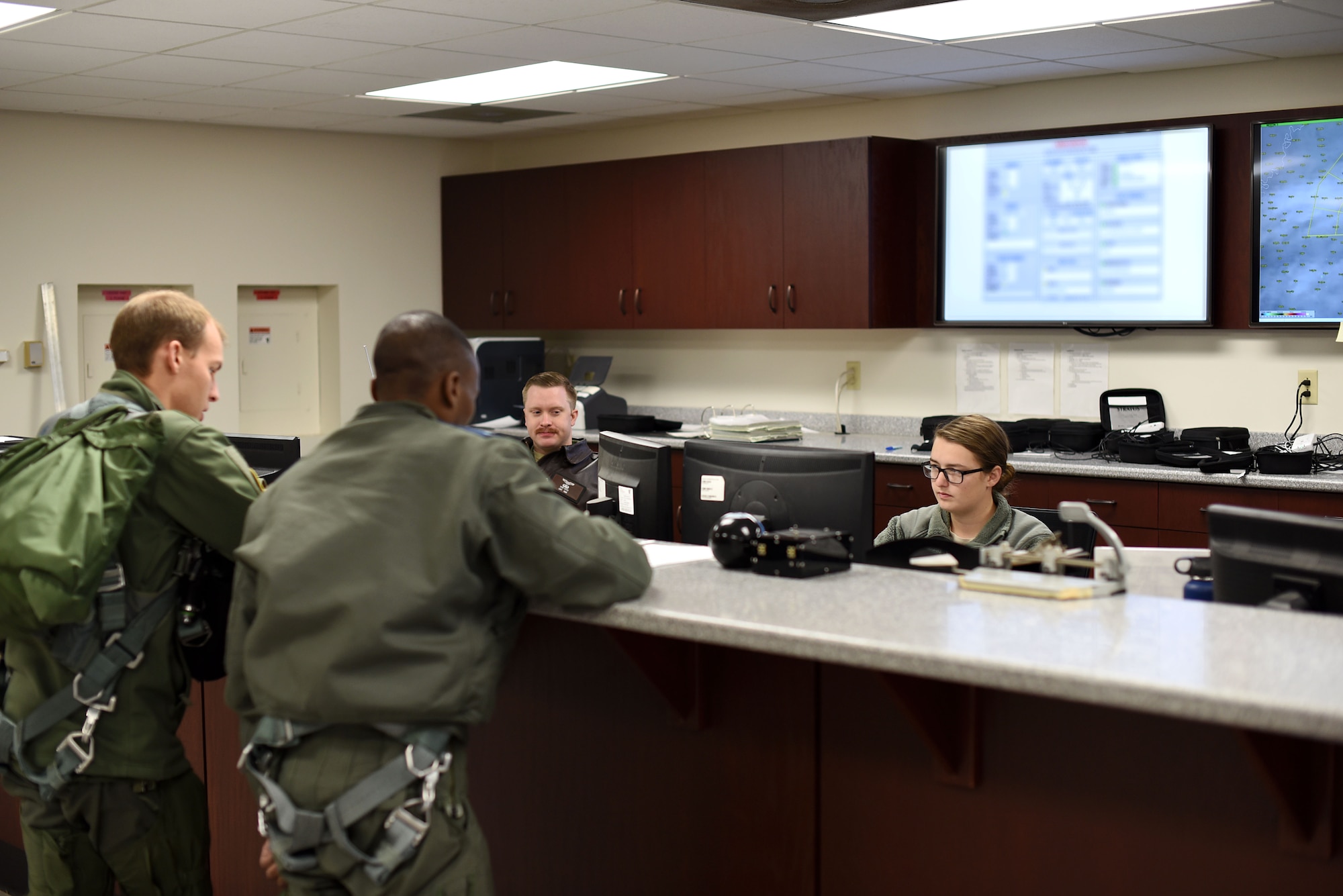 Senior Airman Brianna Cook, 37th Flying Training Squadron aviation resource manager, checks pilots’ currencies (flight documents) before a training mission Jan. 30, 2019, on Columbus Air Force Base, Mississippi. Aviation resource management specialist Airmen are commonly referred to as ‘1Charlies’ based on the Air Force specialty code - 1C0X2. (U.S. Air Force photo by Airman 1st Class Keith Holcomb)