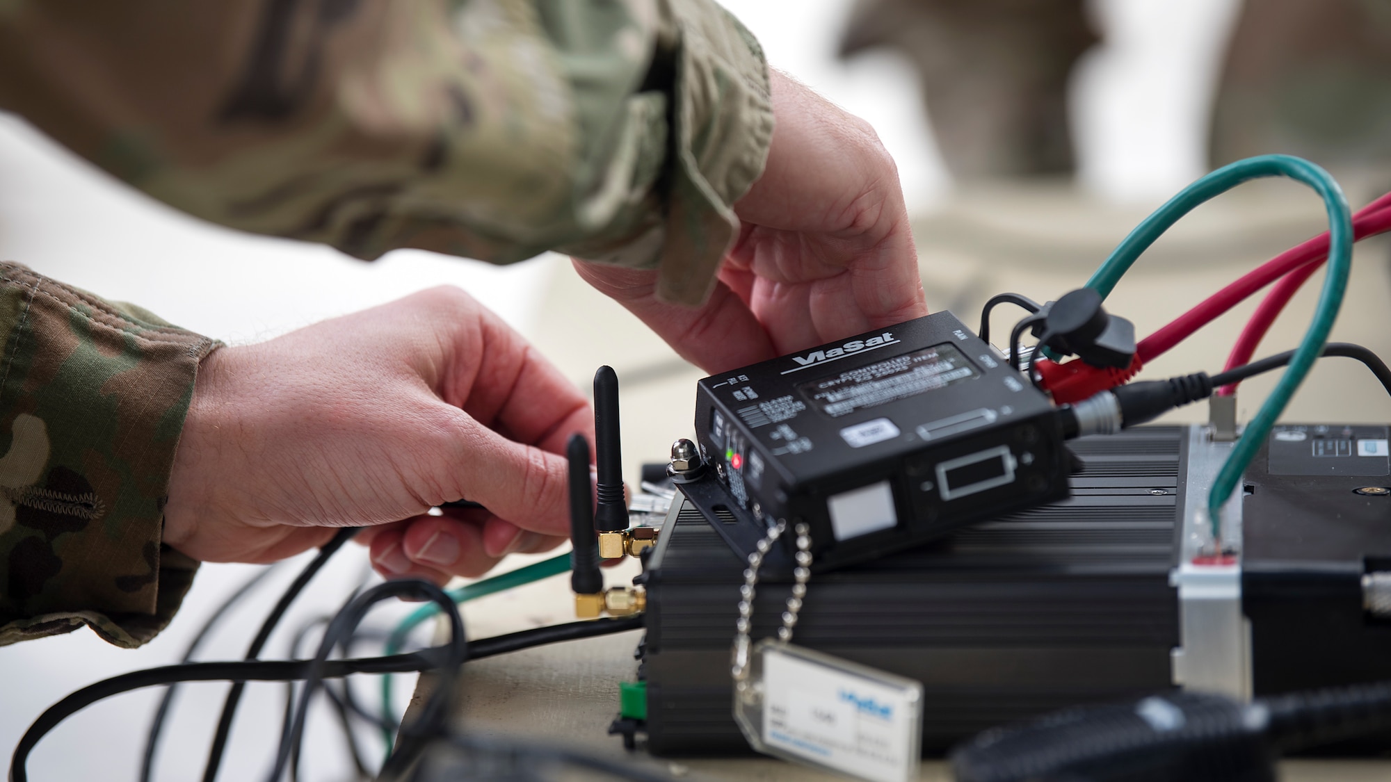 U.S. Army Staff Sgt. Kevin Shells, a Joint Communications Support Element systems team chief, sets up a communications kit at Beer Can Island Jan. 30, 2019, as part of the Cobb Ring exercise. This annual exercise brings together JCSE and their British counterparts, the 30th Signal Regiment, to strengthen relationships and interoperability between the two allies.