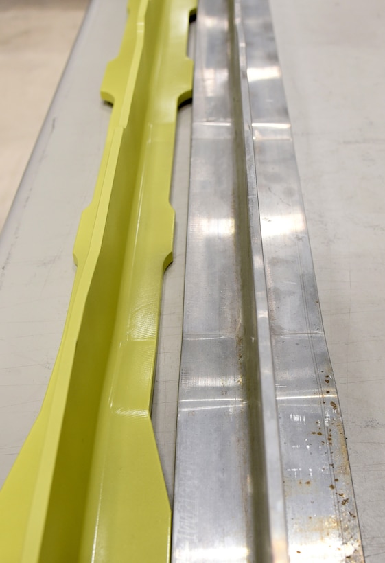 A replacement keel beam, left, created by the 553rd Commodities Maintenance Squadron at Tinker Air Force Base, next to one of the originals taken out of the KC-135 when corrosion was found. (Courtesy photo)