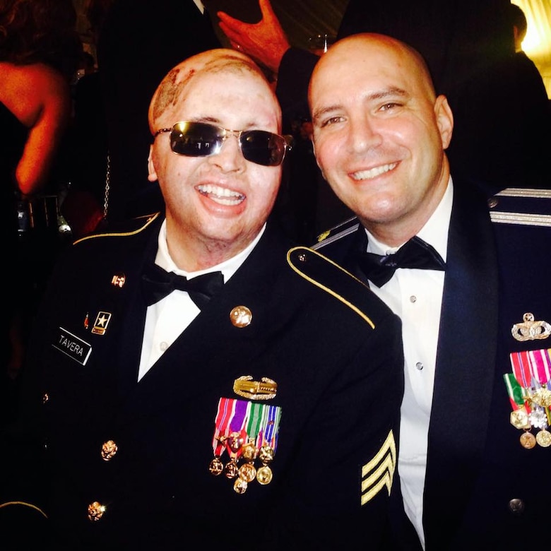 Air Force Lt. Col. Kevin Lombardo, 341st Missile Security Forces Squadron commander, then Maj. Lombardo, right, poses for a photo with Army Sgt. Joel Tavera at a military ball.