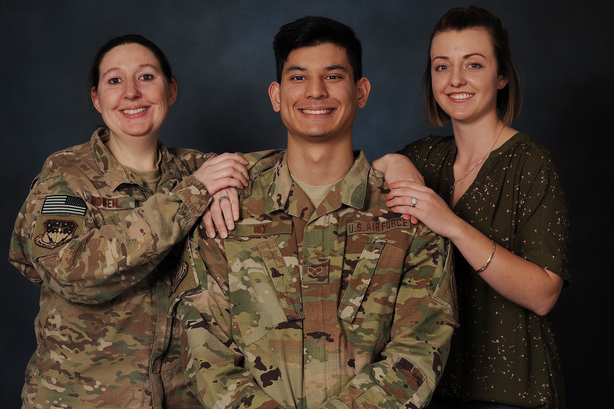 Senior Airman Christopher Wy, 341st Security Forces Support Squadron convoy response force lead, center, poses for a photo with Staff Sgt. Elizabeth Bowen, 341st SSPTS CRF team leader, left, and Senior Airman Cassi Dornon, 341st SSPTS CRF team member Jan. 16, 2019, at Malmstrom Air Force Base, Mont. Dornon and Bowen helped their wingman with a tough life situation.