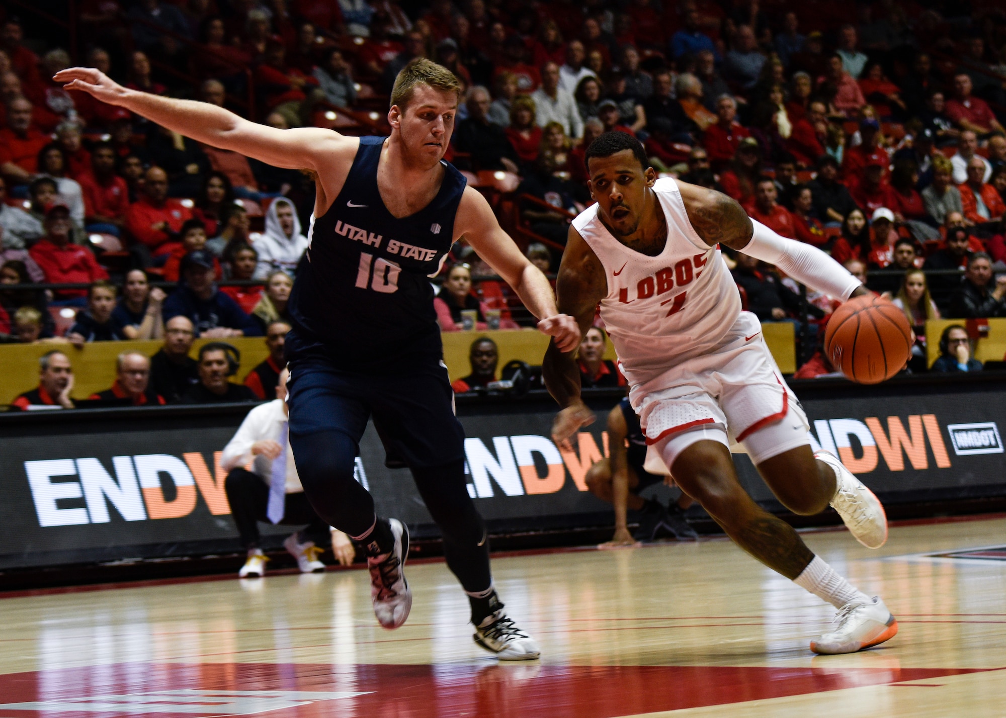 UNM and Utah State basketball players