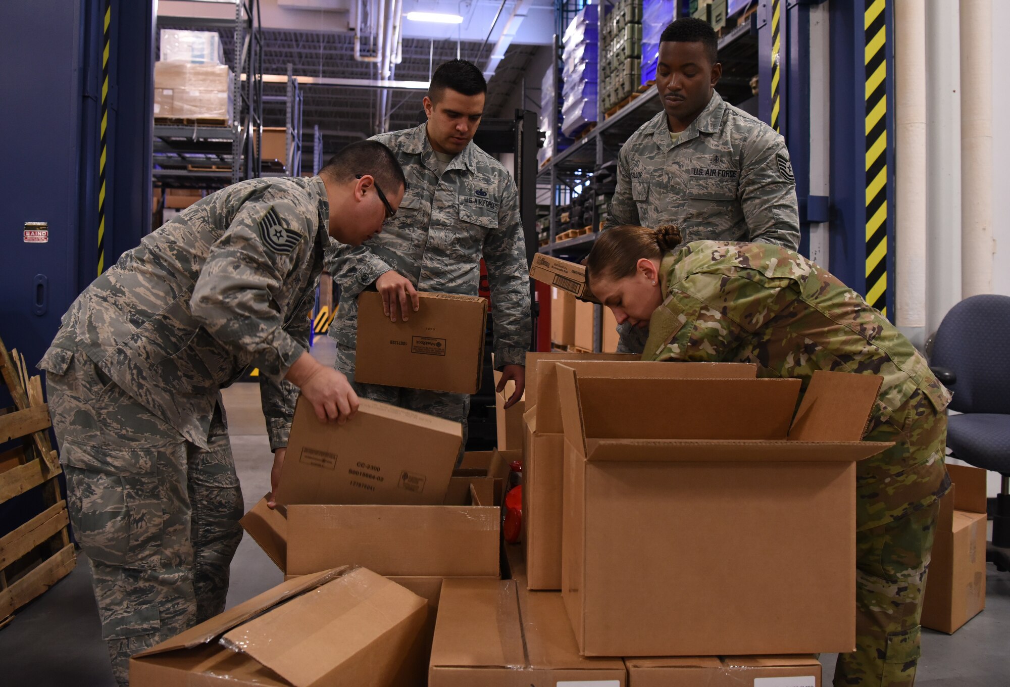 Airmen organize donations provided by the Denver USO Jan. 28, 2019, at F. E. Warren Air Force Base, Wyo. The care packages are part of the USO2GO initiative, where snacks are transported to missile alert facility sites to boost morale for Airmen in the field. (U.S. Air Force photo by Tech. Sgt. Ashley Manz)