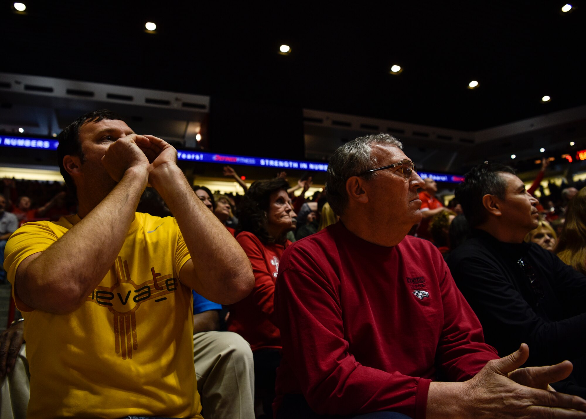 UNM fans at a basketball game.