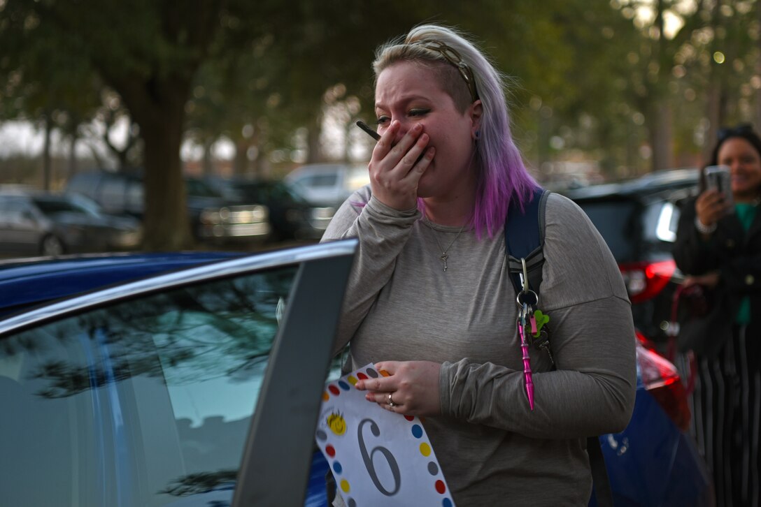 Staci Farland, Team Shaw spouse, opens the door of the free car during a Smile Campaign car giveaway wrap-up party at Shaw Air Force Base, S.C., Jan. 31, 2019.