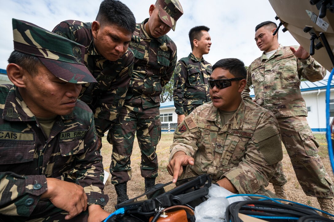 U.S. Air Force Senior Airman Charles Lee, 291st Combat Communication Squadron Radio Frequency Transmission Systems jouneyman, points to a digital display of a spectrum analyzer showing a satellite beacon frequency during Bilateral Air Contingent Exchange-Philippines (BACE-P) at Cesar Basa Air Base, Philippines, January 30, 2019.