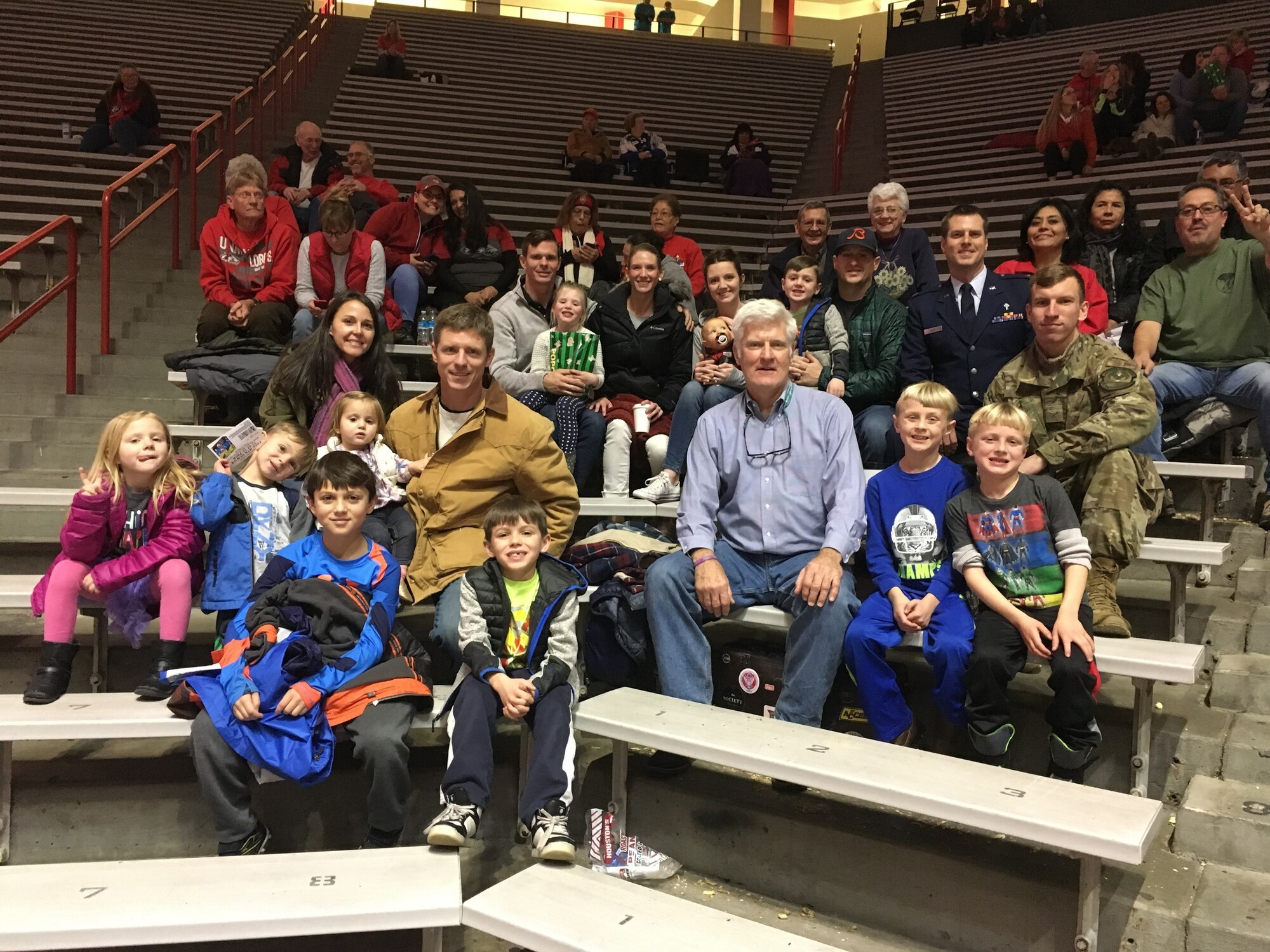 Group of individuals at a UNM basketball game.