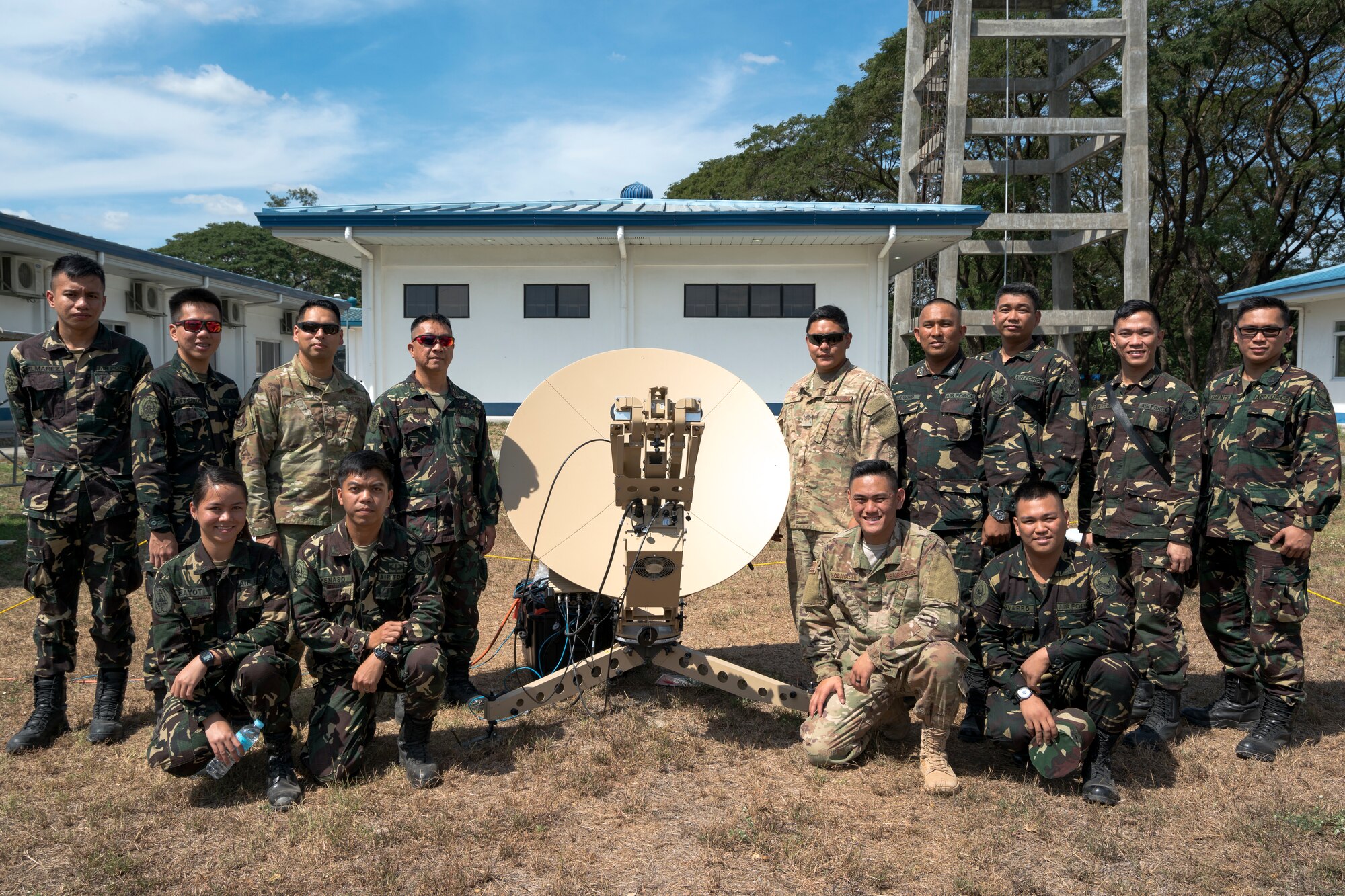 U.S. Air Force communication personnel from the Pacific Air Forces (PACAF) Directorate of Air and Cyberspace Operations and the 291st Combat Communications Squadron pose alongside communication personnel from the Philippine Air Force 950th Communications, Electronics and Information Systems Group upon completion of a subject matter expert exchange during Bilateral Air Contingent Exchange-Philippines (BACE-P) at Cesar Basa Air Base, Philippines, January 30, 2019.