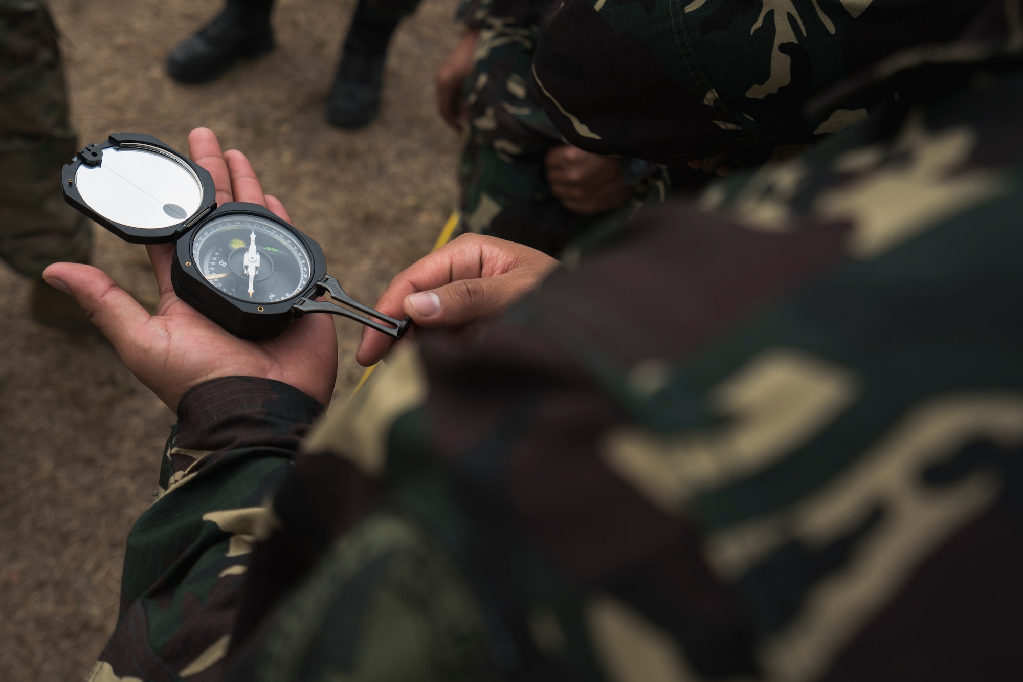 A Philippine Air Force communication specialist from the 950th Communications, Electronics and Information Systems Group practices using a pocket transit to align satellites during Bilateral Air Contingent Exchange-Philippines (BACE-P) at Cesar Basa Air Base, Philippines, January 30, 2019.