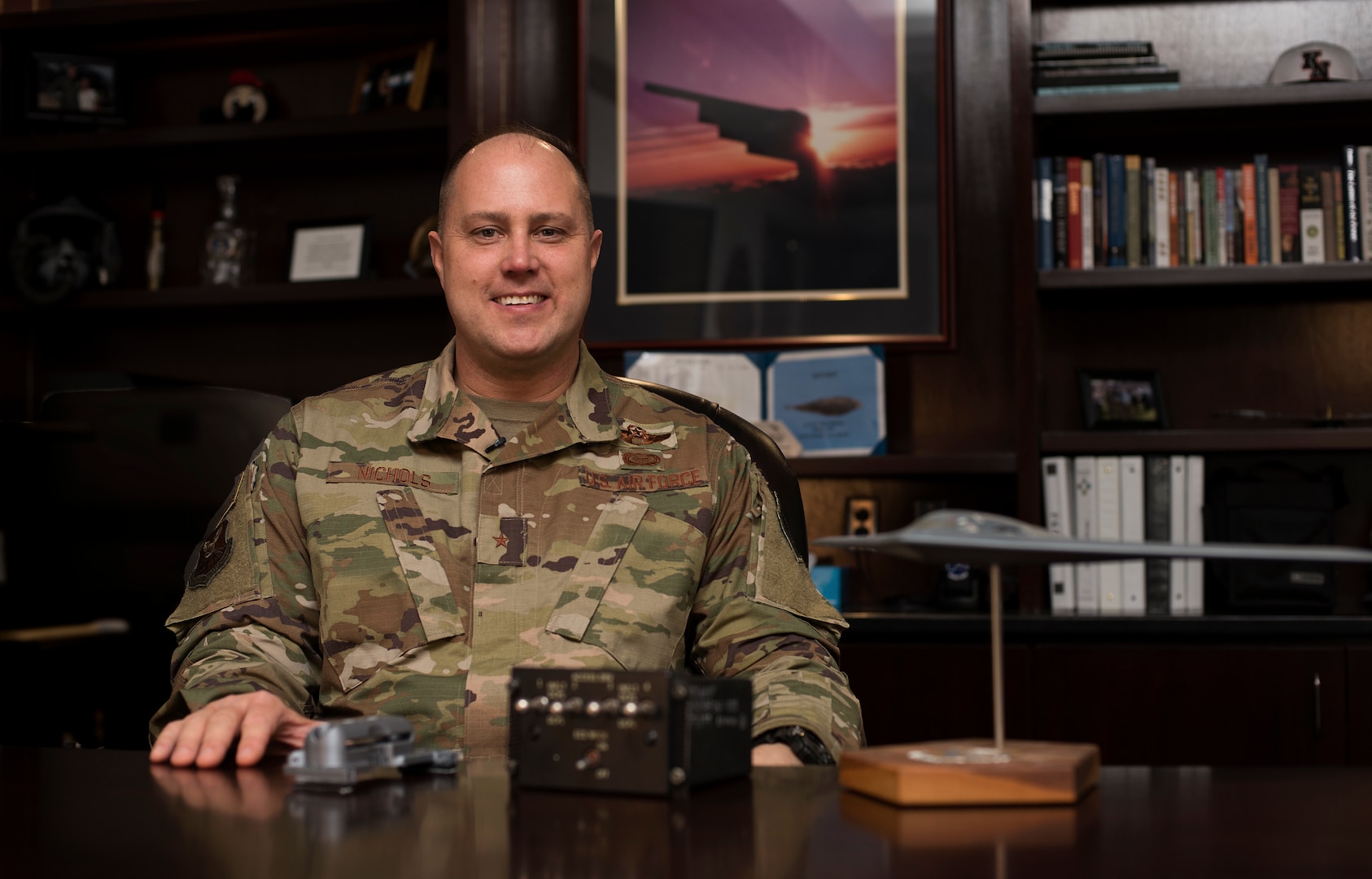 U.S. Air Force Brig. Gen. John J. Nichols, a B-2 pilot and commander of the 509th Bomb Wing at Whiteman Air Force Base, Missouri, tapped the local high school robotics team, asking students to collaborate with Airmen to create a cover for four-switch panel in the B-2’s two-person cockpit. Together, they created a 3-D printed piece that is now used in all 20 of the $2.2 billion aircrafts. “This is an unbelievable story of partnering and innovation,” Nichols said. (U.S. Air Force photo by Staff Sgt. Kayla White)