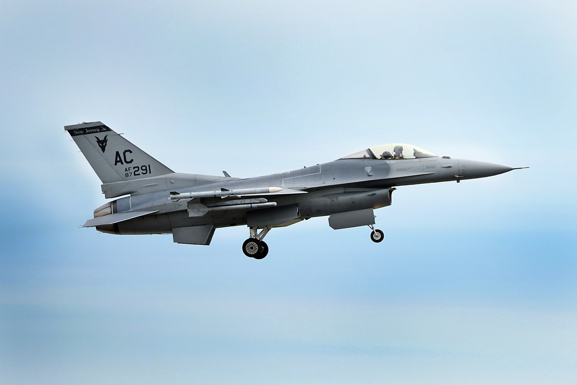 A photo of an F-16C Fighting Falcon from the 177th Fighter Wing flying over Atlantic City.