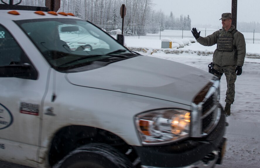 U.S. Air Force Col. Benjamin Bishop, the 354th Fighter Wing commander, participates in a scenario on the MILO Range system with a 354th Security Forces Squadron Airman Jan. 29, 2018, at Eielson Air Force Base, Alaska. Bishop experienced first-hand how the simulator helps prepare Airmen for scenarios they can possibly run into. (U.S. Air Force photo by Senior Airman Isaac Johnson)