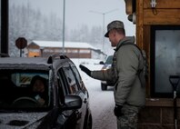 U.S. Air Force Col. Benjamin Bishop, the 354th Fighter Wing commander, participates in a scenario on the MILO Range system with a 354th Security Forces Squadron Airman Jan. 29, 2018, at Eielson Air Force Base, Alaska. Bishop experienced first-hand how the simulator helps prepare Airmen for scenarios they can possibly run into. (U.S. Air Force photo by Senior Airman Isaac Johnson)