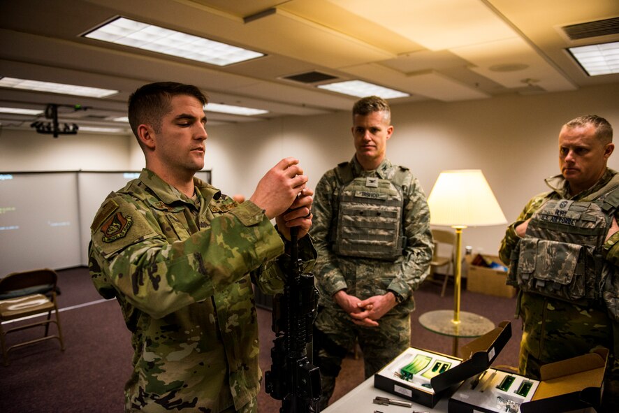 U.S. Air Force Col. Benjamin Bishop, the 354th Fighter Wing commander, participates in a scenario on the MILO Range system with a 354th Security Forces Squadron Airman Jan. 29, 2018, at Eielson Air Force Base, Alaska. Bishop experienced first-hand how the simulator helps prepare Airmen for scenarios they can possibly run into. (U.S. Air Force photo by Senior Airman Isaac Johnson)