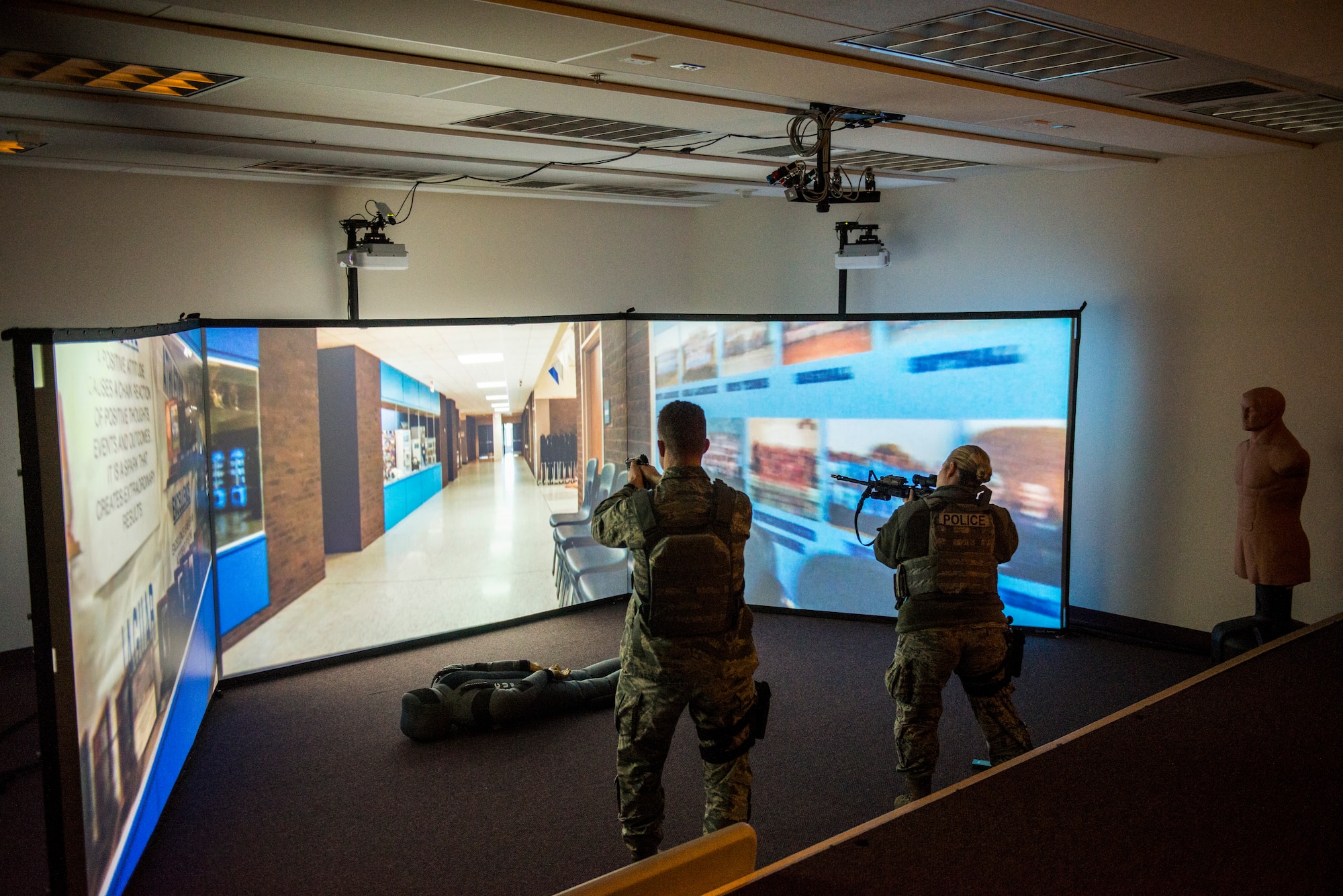U.S. Air Force Col. Benjamin Bishop, the 354th Fighter Wing commander, participates in a scenario on the MILO Range system with a 354th Security Forces Squadron Airman Jan. 29, 2018, at Eielson Air Force Base, Alaska. Bishop experienced first-hand how the simulator helps prepare Airmen for scenarios they can possibly run into. (U.S. Air Force photo by Senior Airman Isaac Johnson)