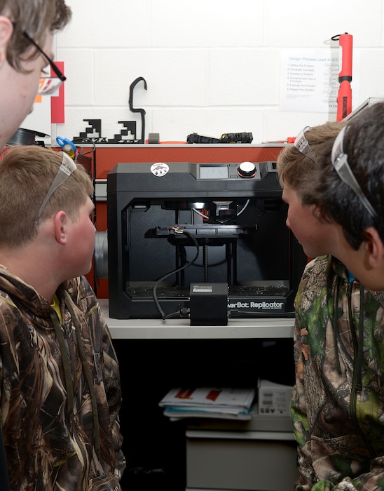 Students on the Knob Noster High School robotics team designed a protective panel that covers four switches in the cockpit of the $2.2 billion B-2 Stealth Bomber. Each panel costs $1.25 to produce. A four-switch panel called the airframe mounted accessory drive, or AMAD, sits on the left side of the B-2’s two-person cockpit. The AMAD switches control the connection of the engines to the hydraulic and generator power of the aircraft. (U.S. Air Force photo by Staff Sgt. Kayla White)