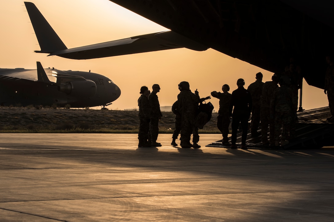 U.S. Air Force and Army personnel load patients in the back of a C-17 Globemaster III at an undisclosed location in Southwest Asia, Jan. 31, 2019. Air Force and Army personnel teamed up to get injured and sick service members home to receive proper care.