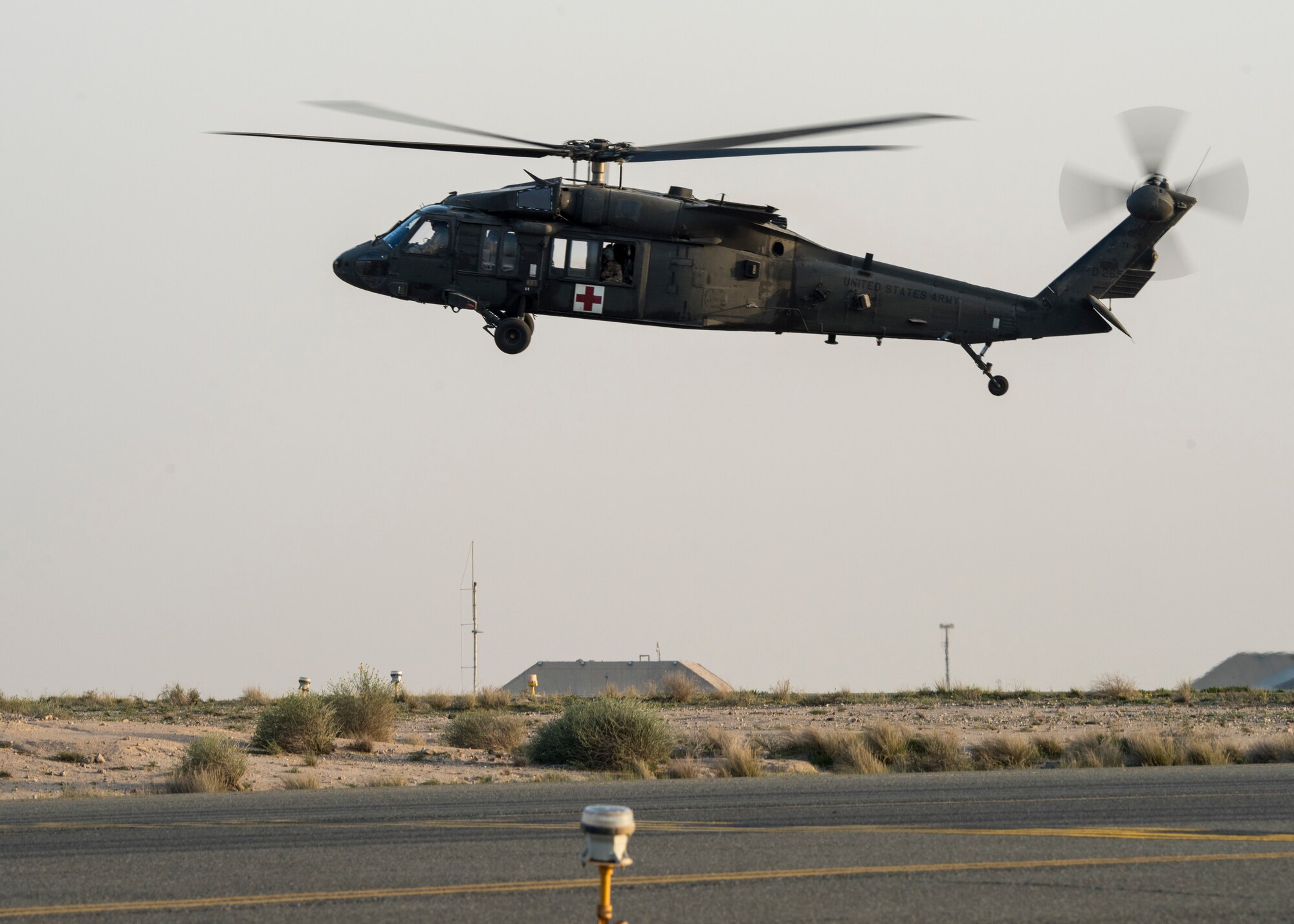 A UH-60 Blackhawk flies in a patient at an undisclosed location in Southwest Asia, Jan. 31, 2019. Air Force and Army personnel teamed up to get injured and sick service members home to receive proper care.