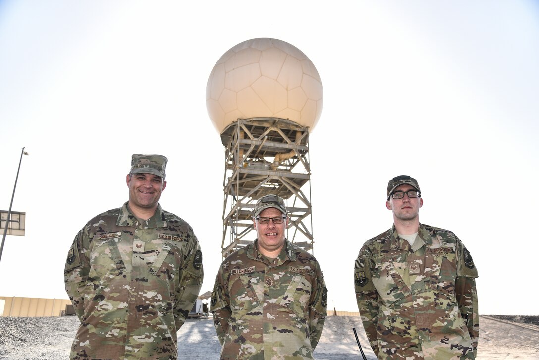 From left, U.S. Air Force Tech. Sgt. Steven Smellie, 727th Expeditionary Air Control Squadron radar maintenance technician; Senior Master Sgt. Martin Hutchinson, 727th EACS NCO in charge of radar maintenance; and Staff Sgt. Evan Rollins, 727th EACS electric protection technician, pose for a photo at Al Dhafra Air Base, United Arab Emirates, Jan. 31, 2019. The 727th Expeditionary Air Control Squadron, also known as the “Kingpin,” is a non-stop shop, comprised of a plethora of assets ranging from the men and women communicating critical information to the radars providing a real-time sight picture of the mission at hand.(U.S. Air Force photo by Senior Airman Mya M. Crosby)