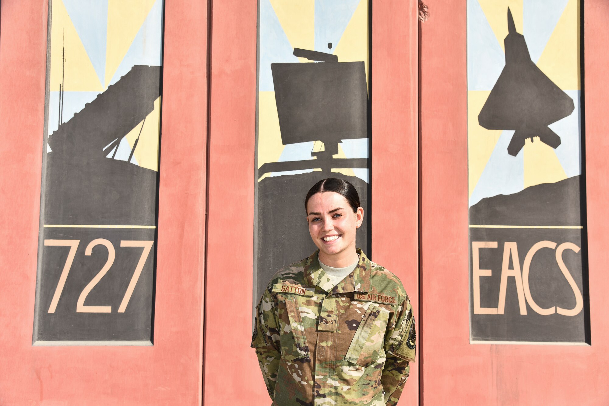 U.S. Air Force Airman 1st Class Brandi Gatton, 727th Expeditionary Air Control Squadron surveillance technician, poses for a photo at Al Dhafra Air Base, United Arab Emirates, Feb. 1, 2019. The 727th Expeditionary Air Control Squadron, also known as the “Kingpin,” is a non-stop shop, comprised of a plethora of assets ranging from the men and women communicating critical information to the radars providing a real-time sight picture of the mission at hand. (U.S. Air Force photo by Senior Airman Mya M. Crosby)
