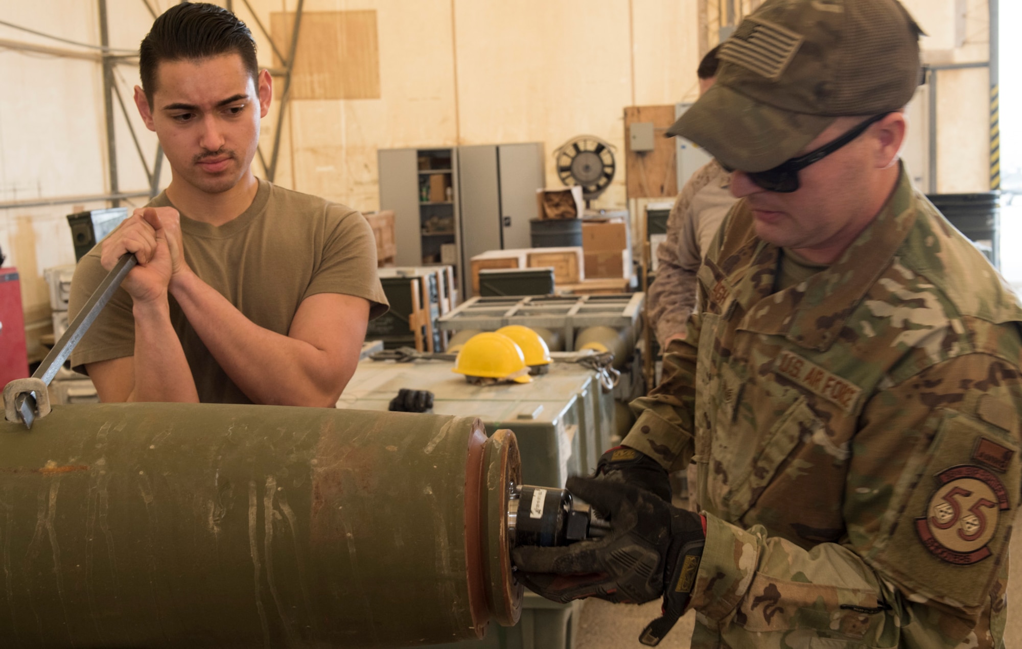 U.S Air Force Munitions crew invite Marines to build bombs in support of OIR