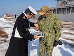 190203-N-CP113-002 ISHIKARI, Japan (Feb. 03, 2019) Capt. George Kessler, Jr., from Albany, Missouri, is greeted by Capt. Takuya Suzuki of the Japanese Maritime Self Defense Force Yoichi Coastal Defense Group, after Ticonderoga-class guided-missile cruiser USS Antietam (CG 54) pulled into Ishikari to attend the 70th Annual Sapporo Snow Festival. This is the 36th year the U.S. Navy has participated in the festival, allowing Sailors a unique opportunity to experience Japanese culture and tradition while strengthening the close friendship between the U.S. Navy and the citizens of Japan. (U.S. Navy photo by Lt. Marissa Liu/Released)