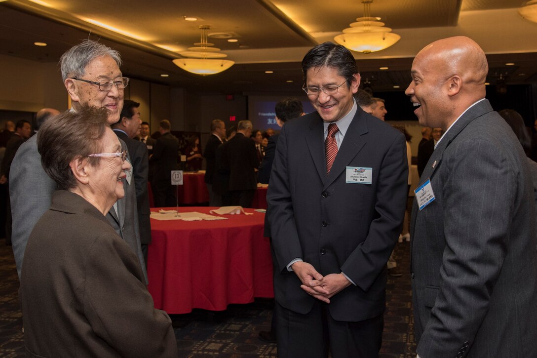 Chief Master Sgt. Elvin Young, 374th Airlift Wing command chief, speaks with members of Fussa-Yokota Goodwill Exchange Club during the U.S.-Japan Joint New Year’s Party at Yokota Air Base, Japan, Jan. 26, 2019.