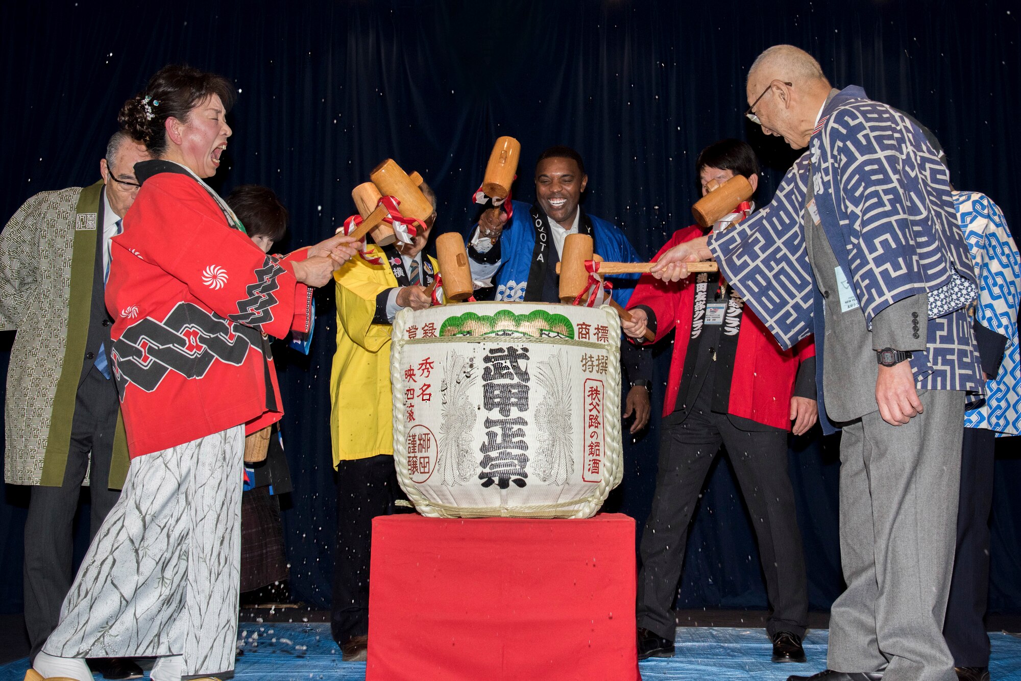 Col. Otis C. Jones, 374th Airlift Wing commander, breaks open a sake keg along with the seven friendship club presidents during the Kagami-biraki ceremony at Yokota Air Base, Japan, Jan. 26, 2019.