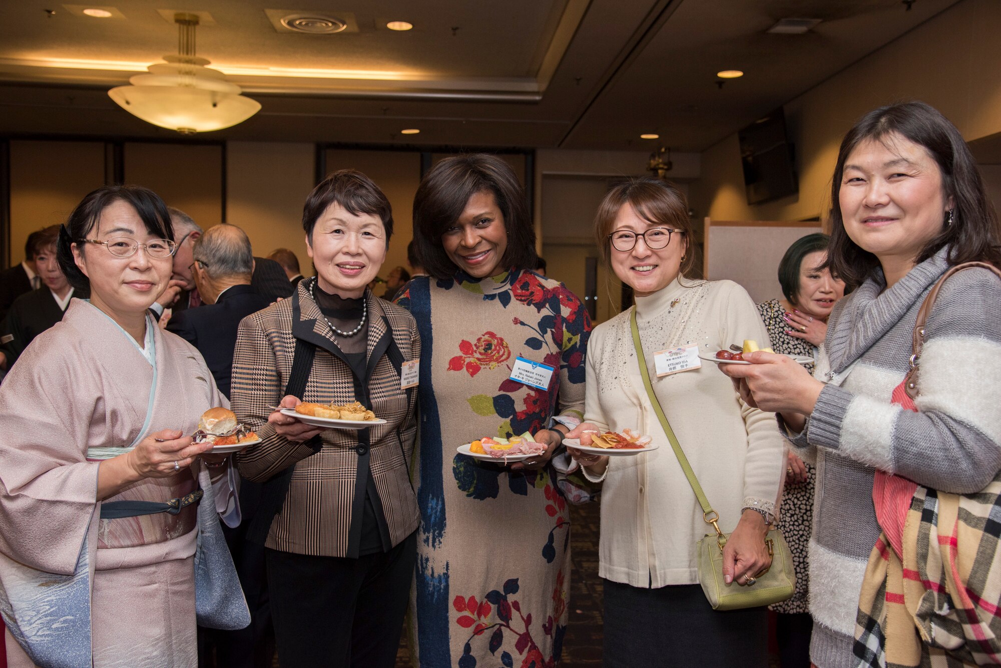 Nataki Jones, wife of Col. Otis C.Jones, 374th Airlift Wing commander, poses for a photo with members of Ome-Yokota Friendship Club during the U.S.-Japan Joint New Year’s Party at Yokota Air Base, Japan, Jan. 26, 2019.