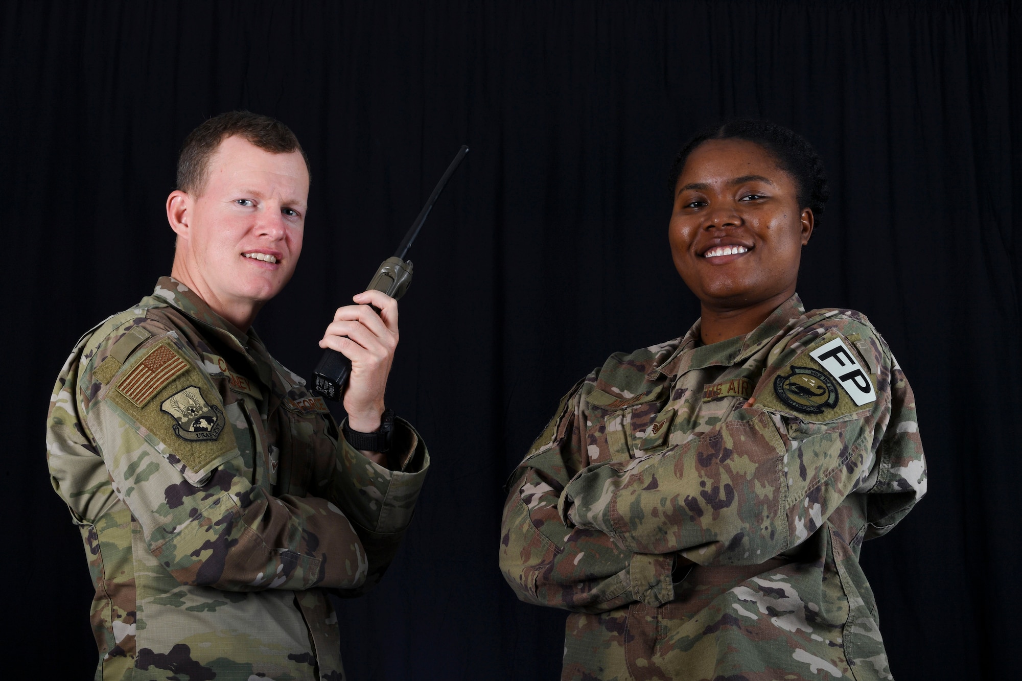 Protection personnel Amn Michael Coveney and Staff Sgt. Aneke Miller pose for a photo at Al Dhafra Air Base, United Arab Emirates, Jan. 31, 2019.