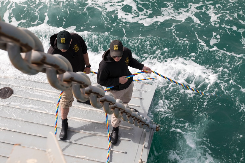 Soldiers assigned to the 86th Engineer Dive Detachment, hold on to umbilical cords, which provides air and communications to divers, during dive supervisor training and qualification near Kuwait Naval Base, Kuwait, Jan. 22, 2019. The Soldiers operate as a team to ensure the divers accomplish their mission as safely as possible.