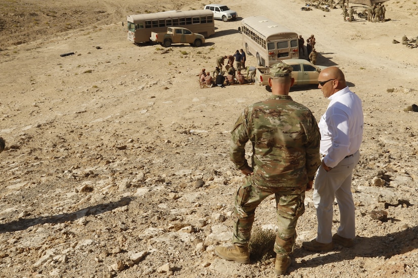 Command Sgt. Maj. Joseph Cornelison, Senior Enlisted Advisor for United States Army Central, more commonly known as ARCENT, speaks with an exercise planner for Inferno Creek 19 as they overlook a break in training in Rabkoot, Oman, Jan. 28, 2019. The U.S. Army and the Royal Army of Oman are spending days in a wadi system conducting team, squad, and platoon maneuvers during exercise Inferno Creek 19. The bilateral exercise was designed to strengthen relations between the two militaries. It is an opportunity for both militaries to build tactical proficiency and gain shared understanding of each other’s forces and support long-term regional stability.