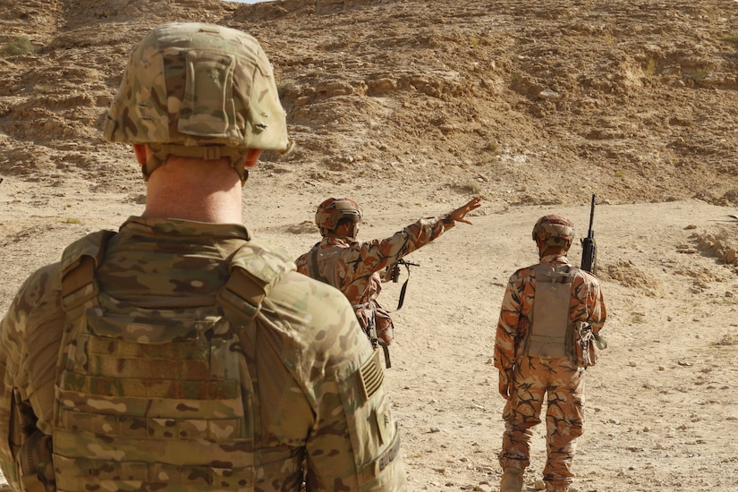 A team leader from 2nd Battalion, 198th Armored Regiment, 155th Armored Brigade Combat Team, Mississippi National Guard, observes Omani troops as they conduct squad movements through a wadi in Rabkoot, Oman, Jan. 28, 2019. ‘Wadi’ translates to ‘valley’ from Arabic to English. The U.S. Army and the Royal Army of Oman are spending days in a wadi system conducting team, squad, and platoon maneuvers during exercise Inferno Creek 19. The bilateral exercise was designed to strengthen relations between the two militaries. It is an opportunity for both militaries to build tactical proficiency and gain shared understanding of each other’s forces and support long-term regional stability.