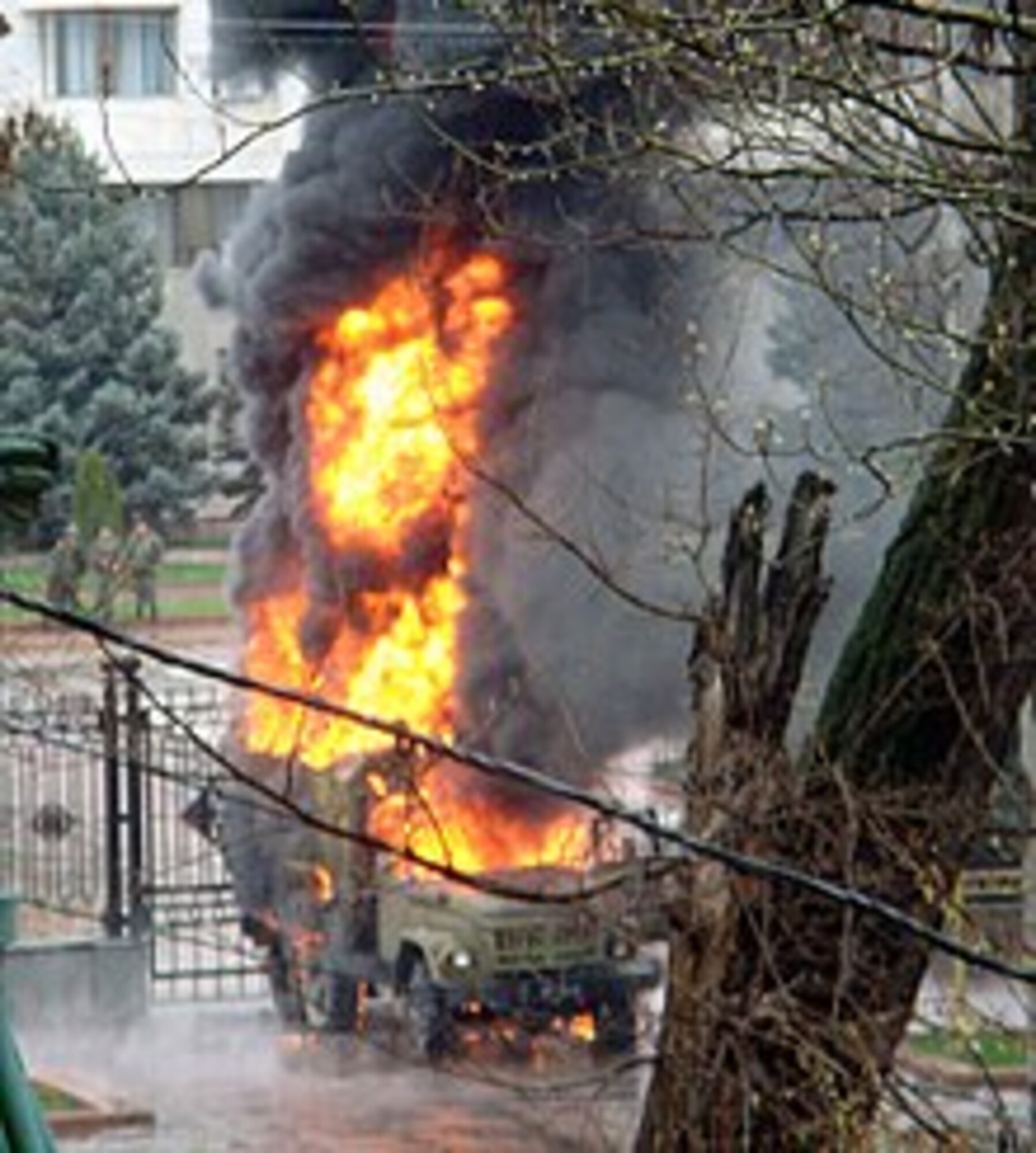 An opposition-captured vehicle burns near the capitol building during citywide protests and riots in Bishkek, Kyrgyzstan on April 7, 2010.