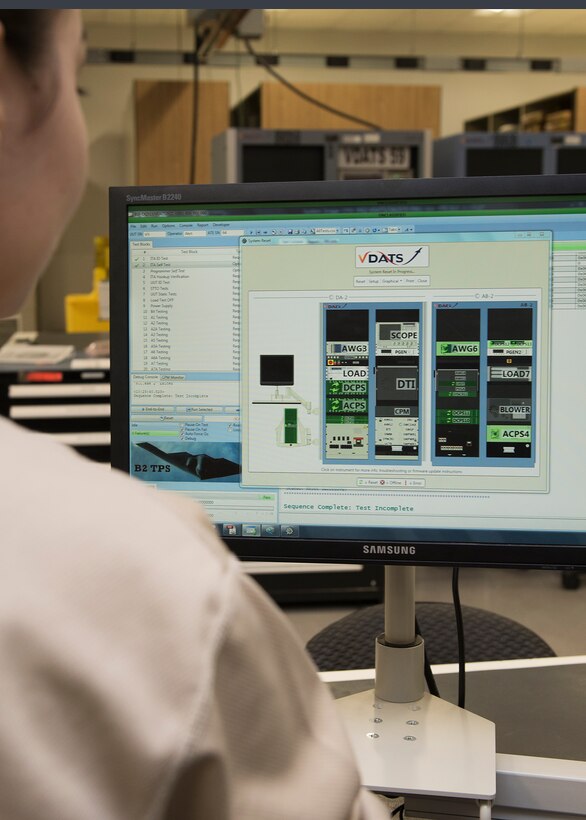Airman 1st Class Vera Schwenk, an avionics technician assigned to the 509th Maintenance Squadron, logs the findings of the Versatile Diagnostics Automatic Test Station.