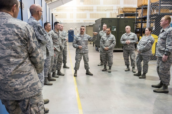 Master Sgt. Jim DeCicco, center, support section supervisor for the 167th Logitics Readiness Squadron, discusses supply processes at the 167th Airlift Wing, Jan. 16, 2019, during a Material Management Advisory Group Region 2 meeting  held at the 167th AW. (U.S. Air National Guard photo by Senior Master Sgt. Emily Beightol-Deyerle)