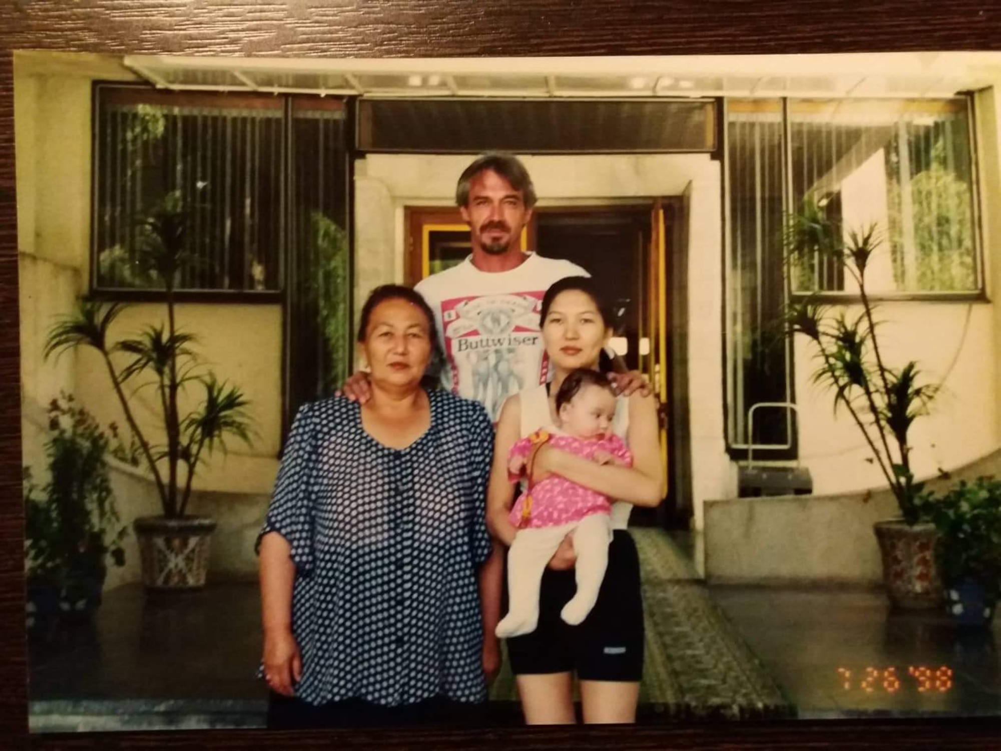 The father, mother and grandmother of Airman 1st Class Vera Schwenk pose for a portrait with her as a baby during a family vacation to Issyk-Kul, a large salt-water lake just outside of her home town of Bishkek, Kyrgyzstan.