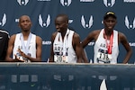 From left, Army Sgt. Hillary Bor, Army Sgt. Leonard Korir, and Army Sgt. Emmanuel Bor stand on an awards stage with their medals after placing the 2nd, 3rd, and 4th in the USA Track and Field Cross Country Championship in Tallahassee, Fl. Feb. 2, 2019. The sergeants finished 1st, 2nd, and 3rd  in the 2019 Armed Forces Cross Country Championship which ran simultaneously with the USATF event. DoD photo by EJ Hersom