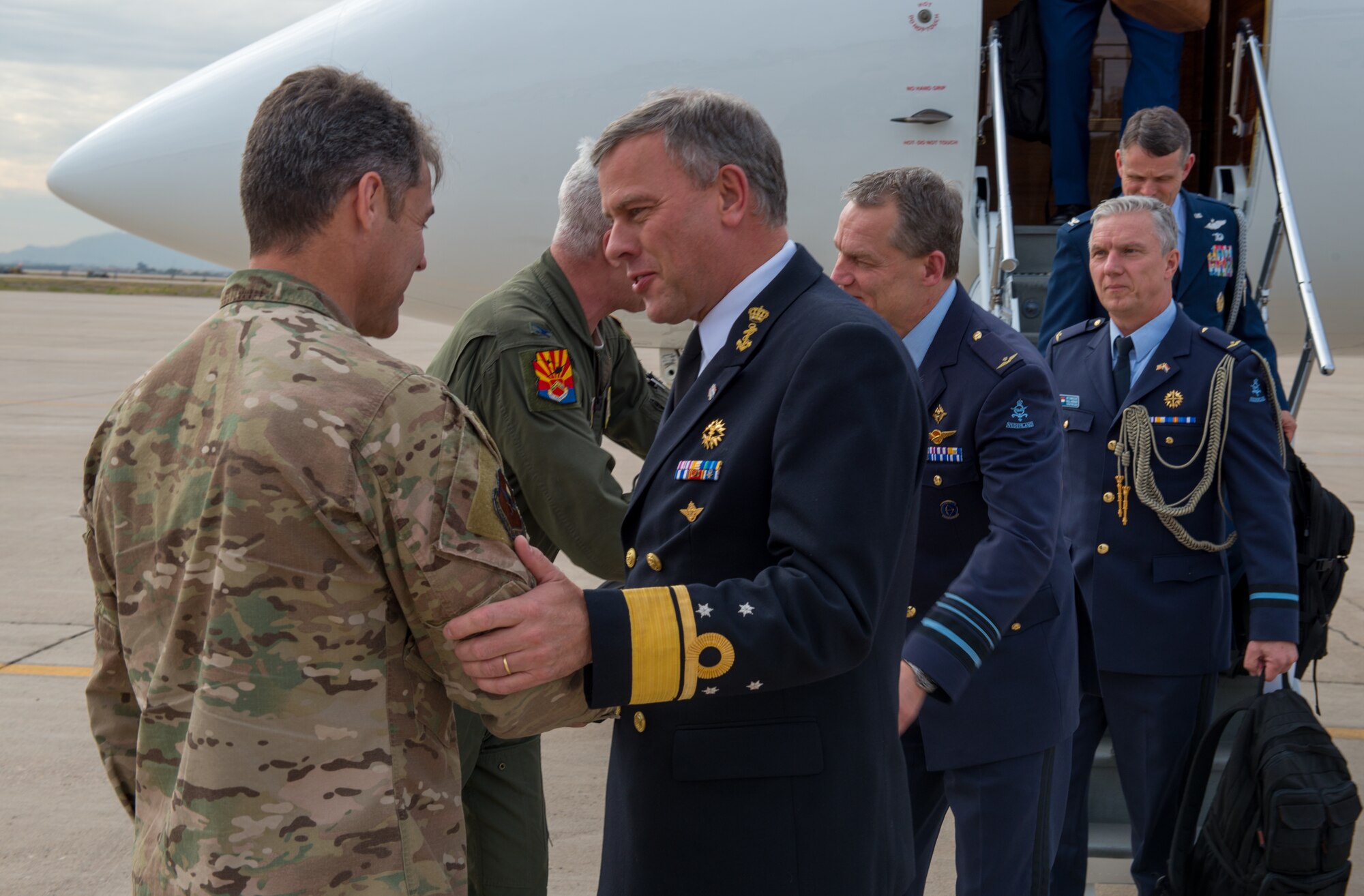 Netherlands Chief of Defense, Lieutenant Admiral Rob Bauer, is greeted by Chief Master Sgt Ronald Thompson, 56th Fighter Wing command chief at Luke Air Force Base Ariz. Jan 30, 2019. Lt. Adm. Rob Bauer visited the reactivated 308th Fighter Squadron to learn how U.S. and Dutch pilots partner to train the world’s best F-35 pilots. (U.S Air Force photo by Airman 1st Class Jacob Wongwai)