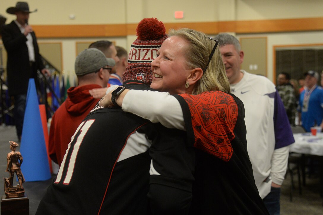 Col. Jennifer Reeves, 341st Missile Wing commander, congratulations Staff Sgt. Ramon Saldana, Airman of the Year recipient, during the 2018 Annual Awards banquet Feb. 2, 2019, at Malmstrom Air Force Base, Mont.