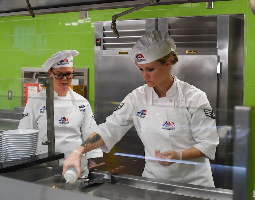 Senior Airman Sierra Romero, 628th Force Support Squadron food services specialist, prepares food for customers after the newly renovated Gaylor Dining Facility officially reopened, Feb. 1, 2019, at Joint Base Charleston, S.C.