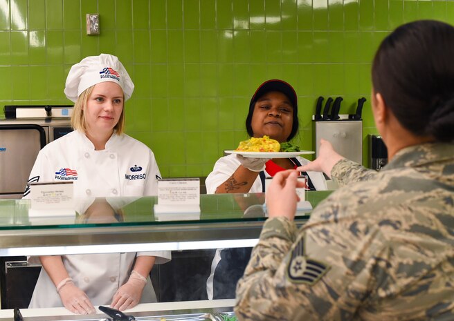 Senior Airman Sierra Romero, 628th Force Support Squadron food services specialist, prepares food for customers after the newly renovated Gaylor Dining Facility officially reopened, Feb. 1, 2019, at Joint Base Charleston, S.C.