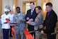 Colonel Terrence Adams, left, 628th Air Base Wing commander, joins Lt. Col. Jacqueline Sukhlall, second from right, Air Force Services Activity Operations Directorate deputy director, along with civilian contractors to mark the opening of the Gaylor Dining Facility Feb. 1, 2019, at Joint Base Charleston, S.C.