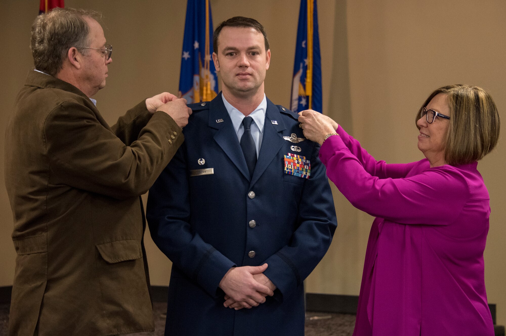Col. Jeremiah S. Gentry, 188th Operations Group commander, has his new rank pinned on by friends and family during his promotion ceremony at Ebbing Air National Guard Base, Fort Smith, Ark., Feb. 2, 2019. Gentry has been a 188th Wing member since 2011 and was instrumental in the establishment of its MQ-9 remotely piloted aircraft mission. (U.S. Air National Guard photo by Tech. Sgt. Daniel Condit)